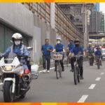 大阪府警平野警察署と子どもたちが自転車のヘルメット着用を呼びかけ　春の全国交通安全運動